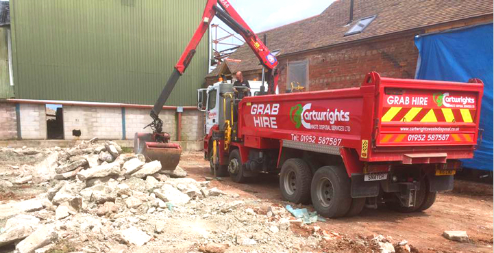 grab lorry collecting refuse